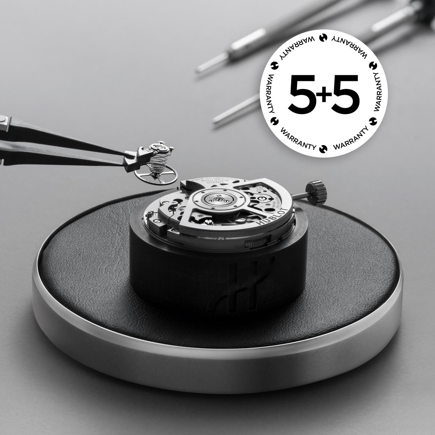 Unico movement assembly with 5+5 warranty logo
